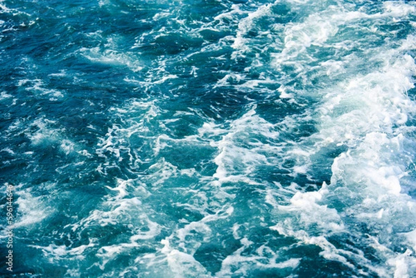 Fototapeta Sea wave breaking and splashing during climate change