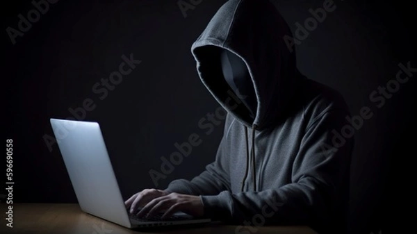 Fototapeta Concept of computer infection and cybercrime with laptop in hand of hooded, faceless individual. Generic AI