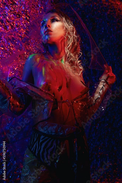 Fototapeta girl in neon light with glowing paints