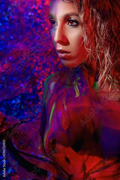 Fototapeta girl in neon light with glowing paints