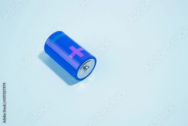 Fototapeta Batteries isolated on cyan background