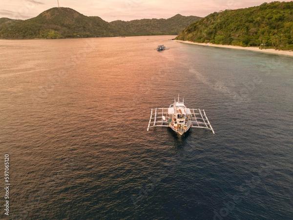 Fototapeta Aerial view of a boat in the islands of Palawan