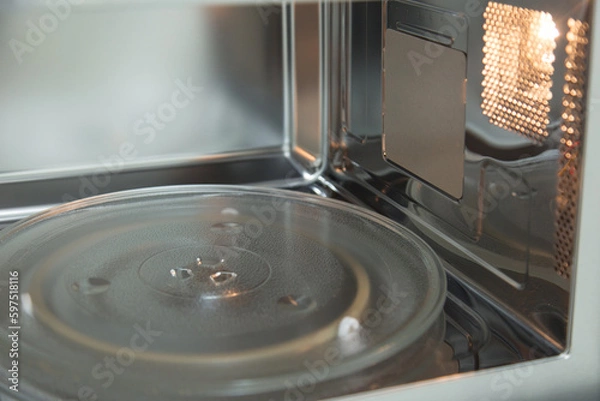 Fototapeta opened microwave inside oven close-up 