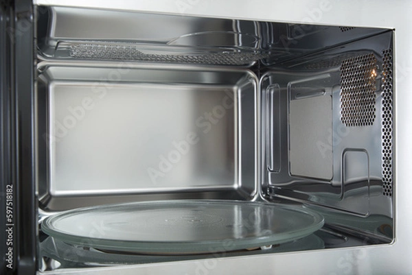 Fototapeta opened microwave inside oven close-up 