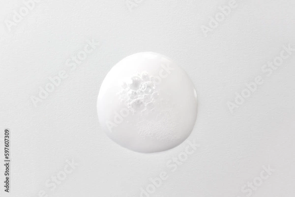 Fototapeta Drop of oxygen gel or serum on a white background. Sample of a cosmetic product. Selective focus.
