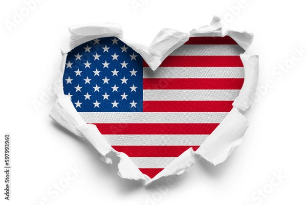 Fototapeta Heart shaped hole torn through paper, showing satin texture of flag of USA, cut out