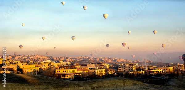 Fototapeta Mountain landscape with hot air balloons in the sky in cappadocia . Travel and adventure concept in Turkey
