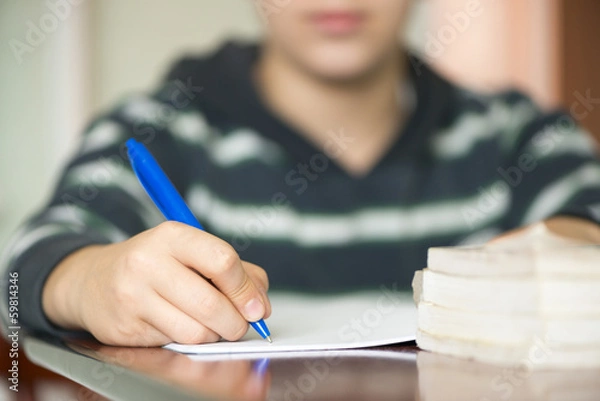 Obraz Cute boy doing his school homework