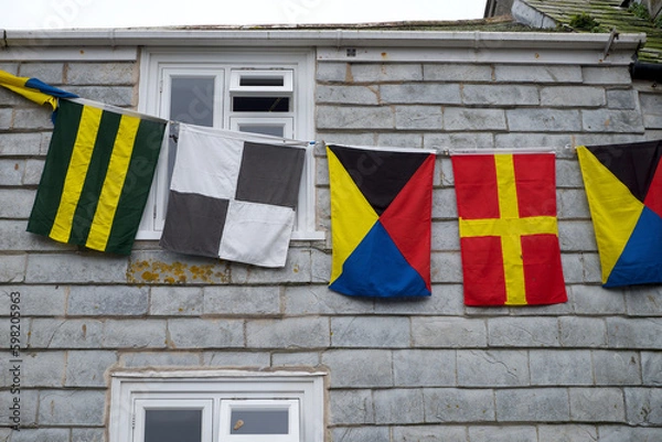 Obraz Padstow Cornwall UK 04 30 2023 May Day flags and pennants