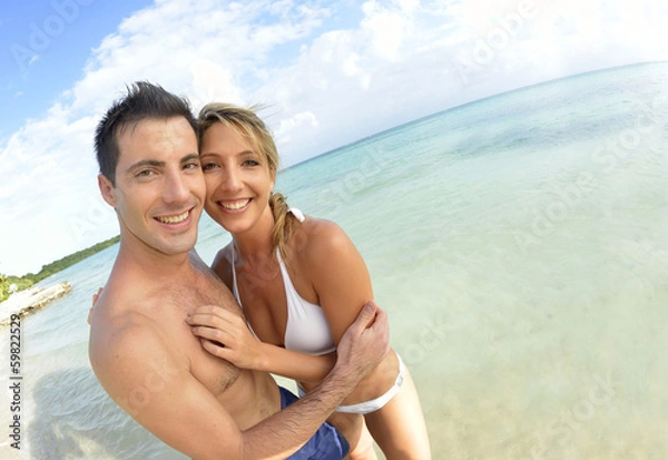 Obraz Couple having fun at the beach