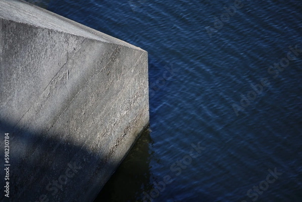 Fototapeta Rough Cement Wall Structure Inside Lake