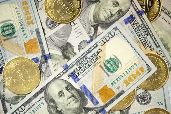 Obraz Gold Bitcoin on hundred dollars bills. Close-up