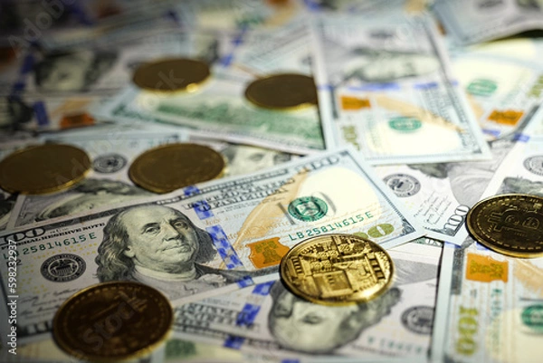 Obraz Gold Bitcoin on hundred dollars bills. Close-up