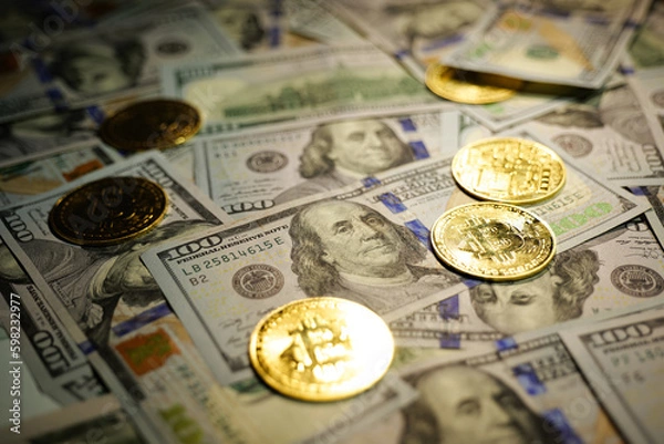 Obraz Gold Bitcoin on hundred dollars bills. Close-up