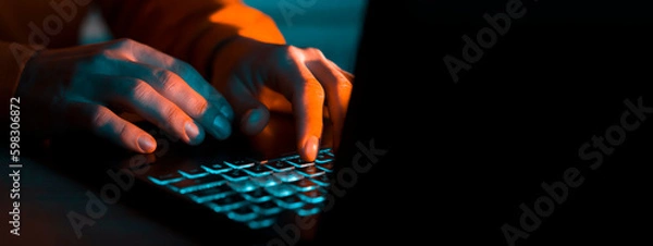 Fototapeta Hands types on a laptop keyboard.