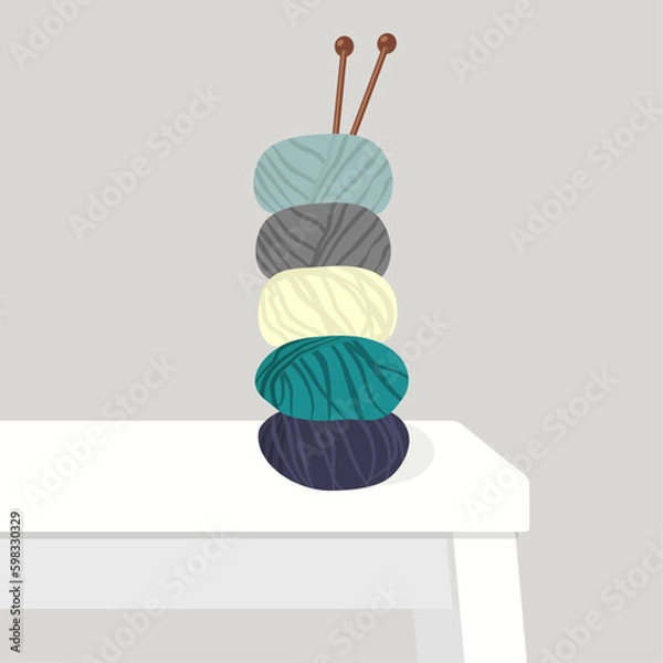 Fototapeta Balls of yarn with wooden knitting needles on the table. Cartoon vector illustration.