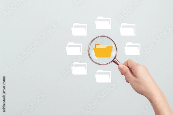 Fototapeta Magnifier glass focus to File Sharing, Folder document Management System DMS Open File folder with flying blank Document Transferring concept. searching and managing files.