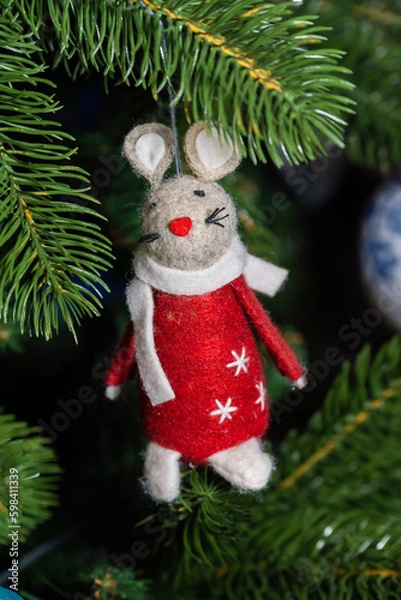 Fototapeta Russia. Kronstadt. January 19, 2023. Festive decoration - a mouse in a red coat on a Christmas tree.
