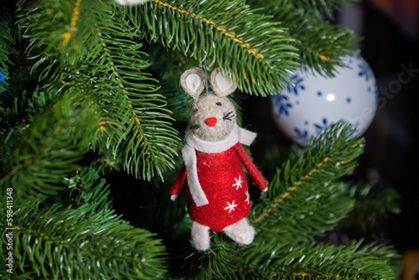 Fototapeta Russia. Kronstadt. January 19, 2023. Festive decoration - a mouse in a red coat on a Christmas tree.