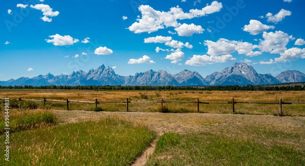 Obraz Grand Teton mountain range over the plain with fence in the front. Grand Teton National Park, United States.