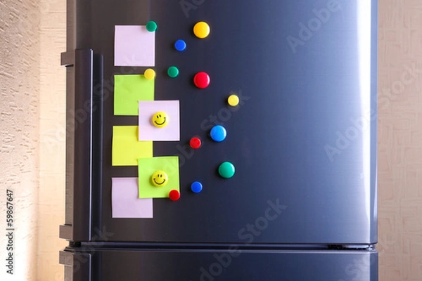 Fototapeta Empty paper sheets and colorful magnets on fridge door