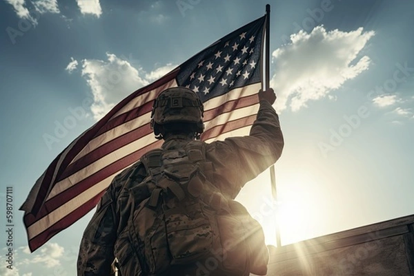 Obraz An American soldier with an American flag in his hand looks out into the clear weather for Day of Remembrance or July 4, Day of Remembrance. generative ai