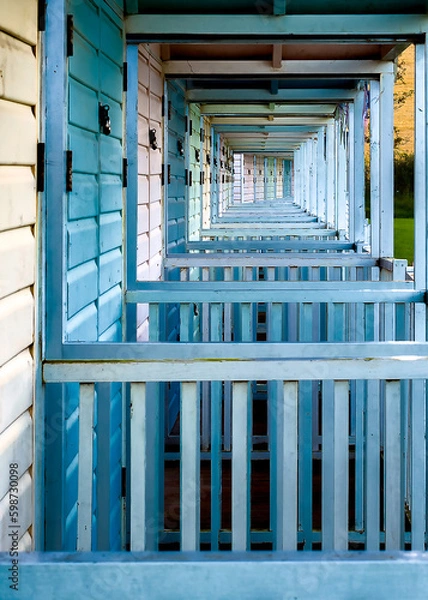 Obraz blue and white tunnel of beach huts