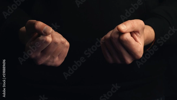 Obraz Two human fists isolated on black background