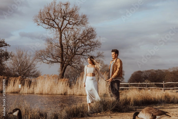 Obraz happy couple in the park on a beautiful sunny day