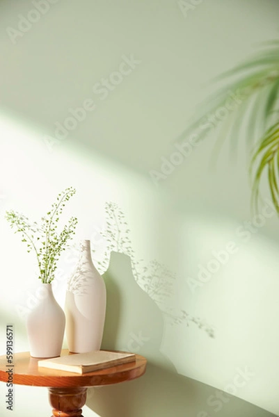 Fototapeta Vases and objects on the table in a warm room with sunlight coming in