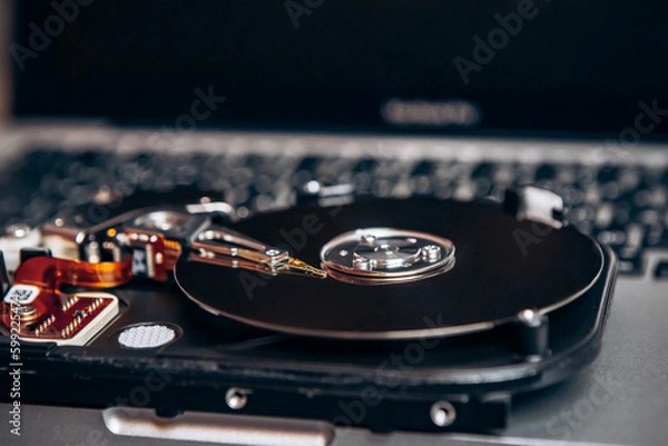 Fototapeta Computer disassembled HDD hard drive data disc SSD, backup part of the PC or laptop. Recovery, fixing technology maintenance work, access file. Engineer profession repairman tools for repair

