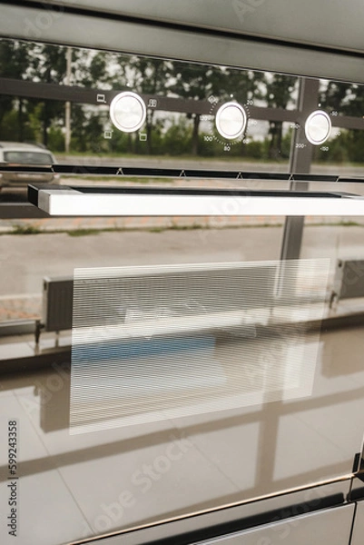 Obraz Reflective surfaces of a futuristic induction hob in black. A fuzzy, blurry photograph of a reflection in the surface of a slab.