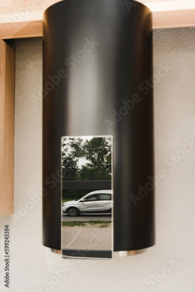 Obraz Reflection of the surface of the water heater in silver black. A fuzzy, blurry photo of a reflection on the column surface. Fake column in the kitchen interior