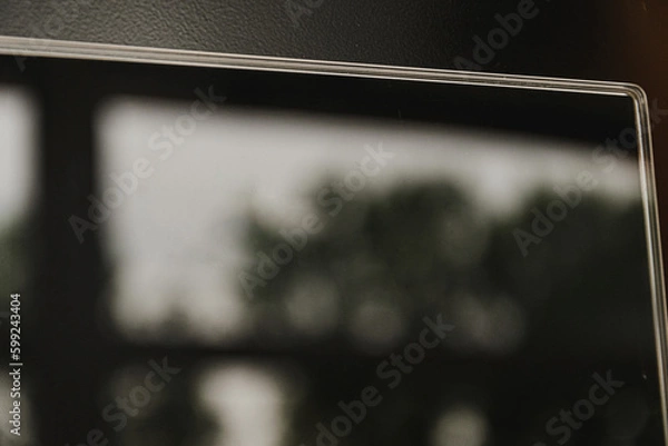 Obraz Reflective surfaces of a futuristic induction hob in black. A fuzzy, blurry photograph of a reflection in the surface of a slab.