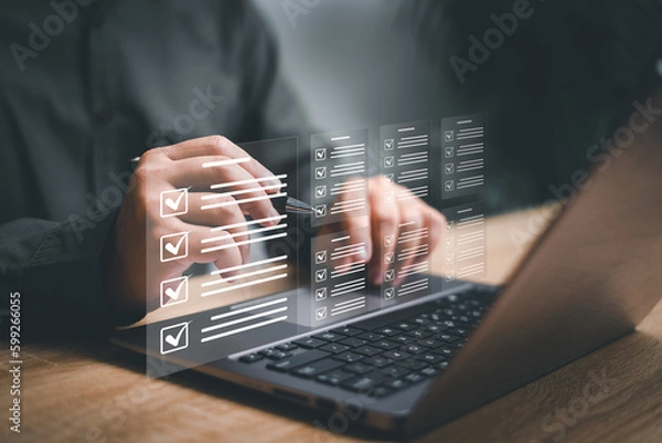Fototapeta Electronic smart checklist and document management on virtual screens, Businessman use laptop and check electronic documents on digital documents, paperless offices concept and technology