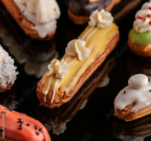 Obraz eclairs with different fillings and decorations in different options