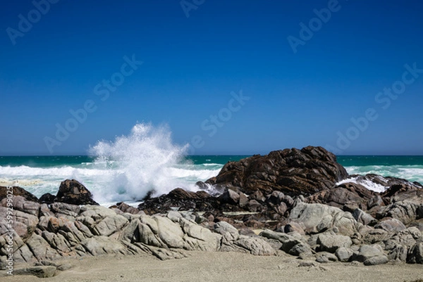 Obraz Rocky beach at Tsaarbank in West Coast national Park, Langebaan with waves crashing on the rocks.