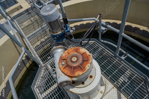 Obraz Agitator of sludge clarifier with motor that had rusty. The photo is suitable to use for animal background and content media.