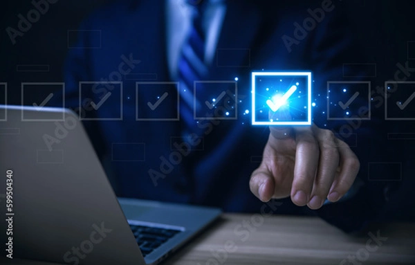 Fototapeta Businessman ticking checkmark on a box in the list. Checklist Ideas in Business Survey items and questionnaires.	
