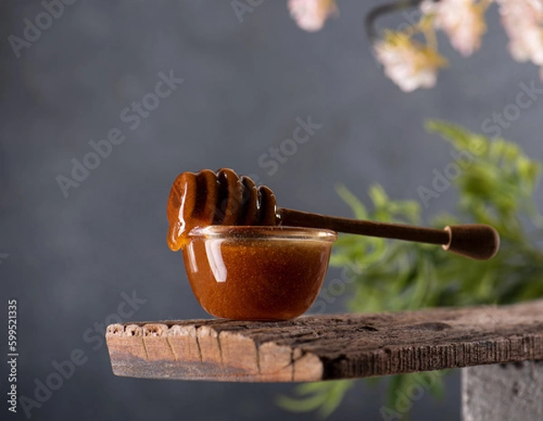 Obraz honey dripping from a jar