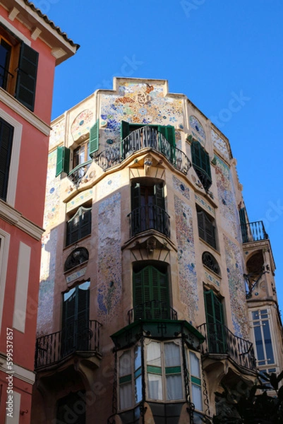 Obraz Residential building with green shutters, decorated with mosaics on the street of Palma de Mallorca. Majorca. Spain.