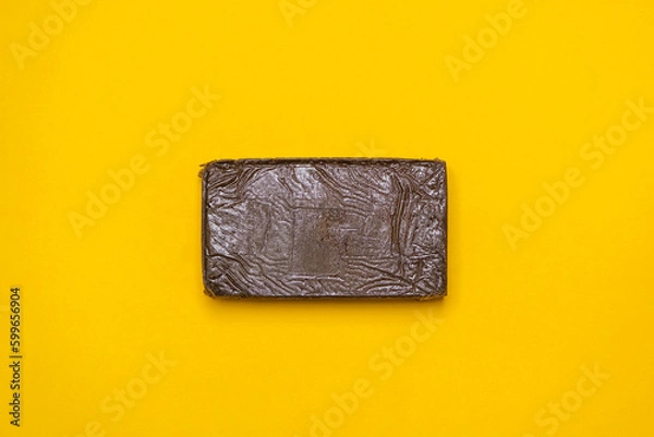 Fototapeta Chemdawg filtered hash. Medical marijuana extraction super dry hashish high quality cannabis pollen on a yellow background.