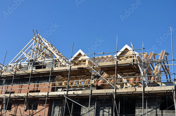 Obraz Roof under construction under blue sky