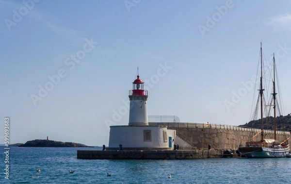 Obraz The picturesque Ibiza lighthouse surrounded by water, sky, and seagulls