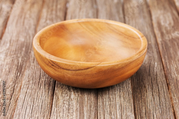 Obraz Empty bowl on old wooden surface.