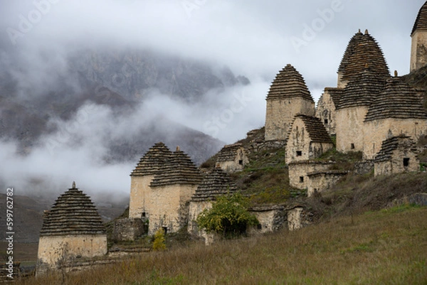 Fototapeta A fragment of the ancient burial complex of Dargavs in the mountain landscape. North Ossetia-Alania, Russia
