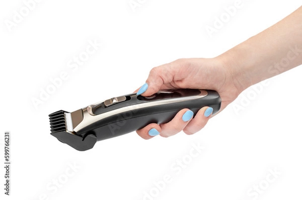 Fototapeta Woman's hand holding accumulator clipper. Isolated on white.