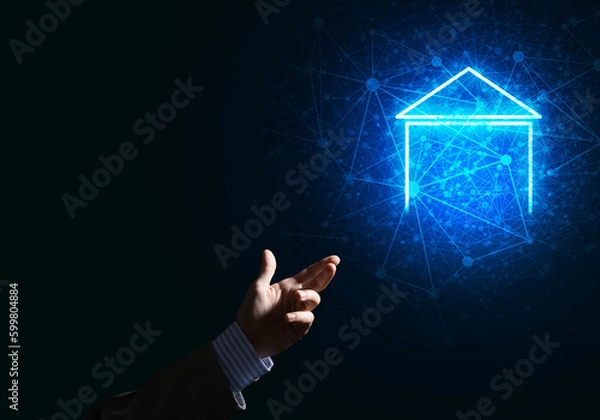 Obraz Conceptual image with hand pointing at house or main page icon on dark background