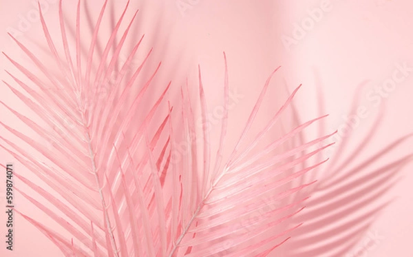 Fototapeta Summer aesthetic layout with pink palm leaves on pastel pink background. 80s or 90s retro idea. Minimal summer fashion idea.