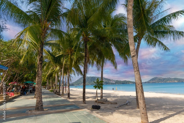 Fototapeta Patong Beach Phuket Thailand nice white sandy beach clear blue and turquoise waters and lovely blue skies with Palms tree sunset sunrise